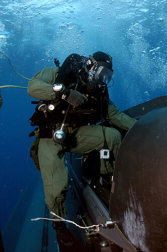 US_Navy_050505-N-3093M-001_A_member_of_SEAL_Delivery_Vehicle_Team_Two_(SDVT-2)climbs_aboard_one_of_the_team's_SEAL_Delivery_Vehicles(SDV)_before_launching_from_the_back_of_the_Los_Angeles-class_attack_submarine_USS_Philadelph