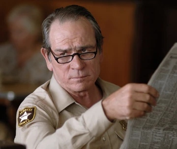 Ed_Tom_Bell_with_a_Newspaper