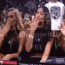 bearded-guy-send-kiss-behind-two-girls (1)